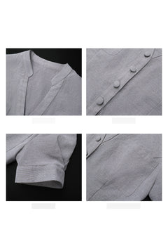 Close-up of the grey dress showing the stand-up collar, buttons, and chest pocket details.