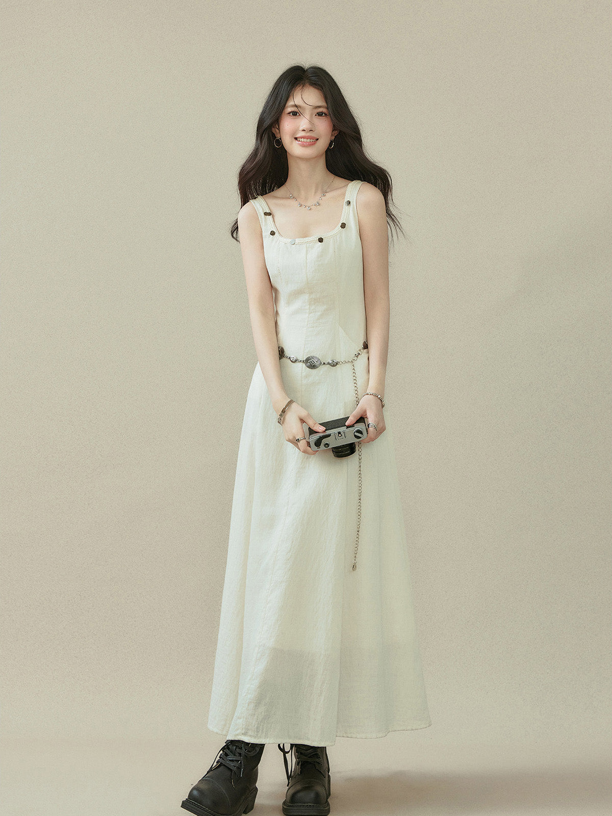 Ivory A-line dress with a straight hem, visible side seam darts, and button details on the neckline.