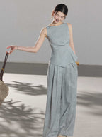 Light blue long pleated skirt with visible side seam