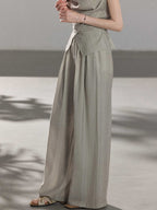 Light grey full-length pants with a straight hem and side pockets.