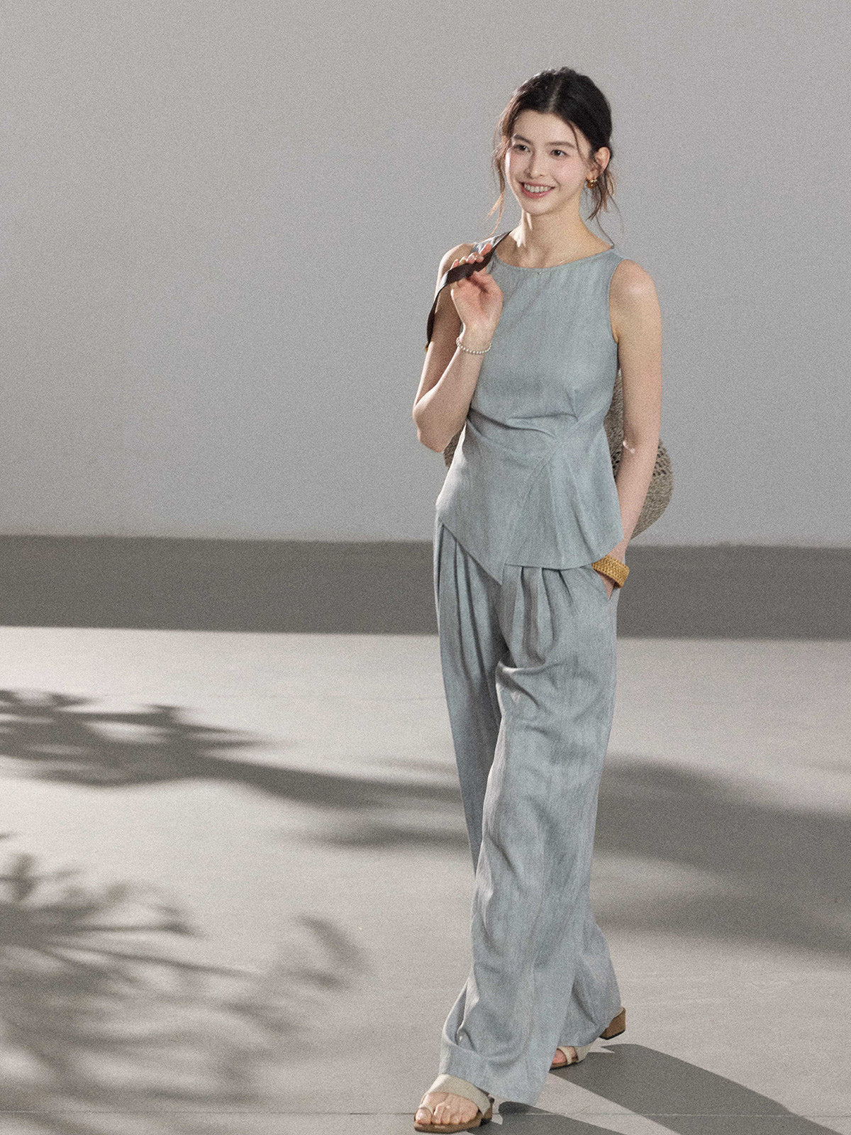 Light blue a-line pleated skirt from angled view