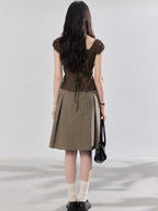 Back view showing the tie-waist detail of the brown top.