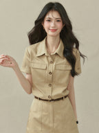 Beige A-line dress with collar, short sleeves, and two chest pockets.