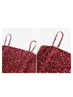 Back view of red floral tank top showing thin straps and peplum waist.