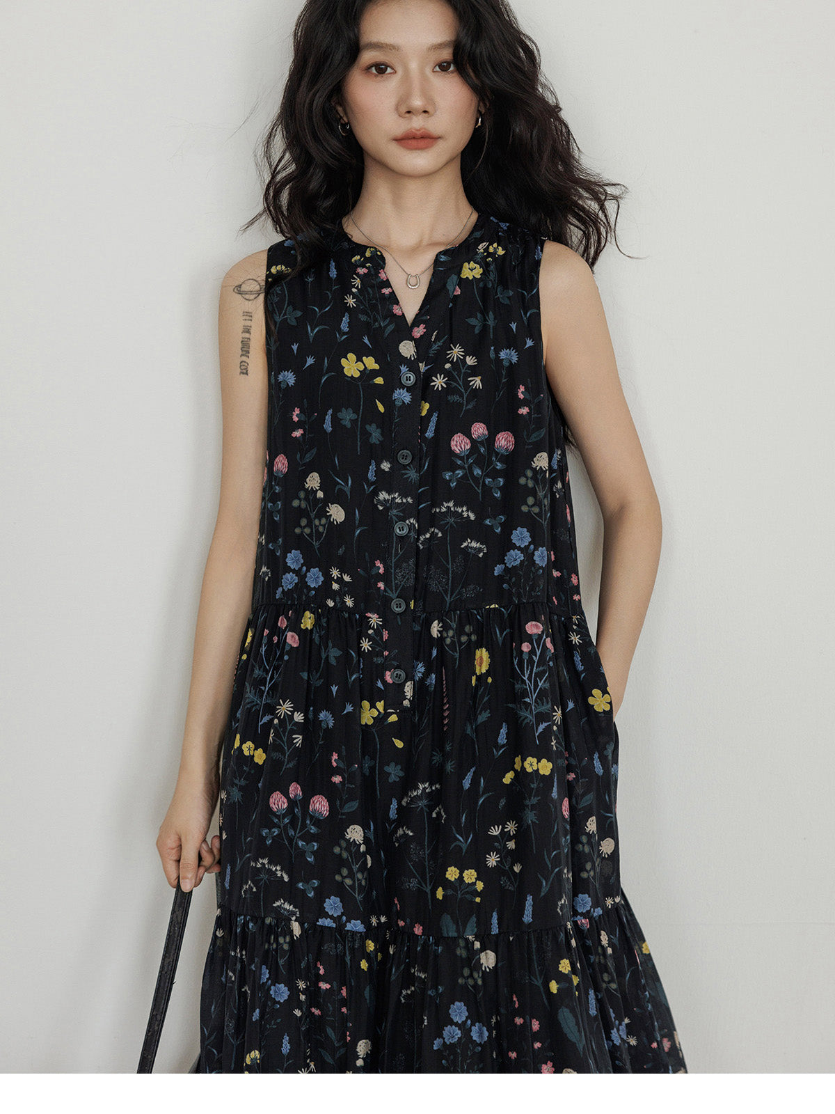 Black floral dress with tiered skirt and gathered waist detail