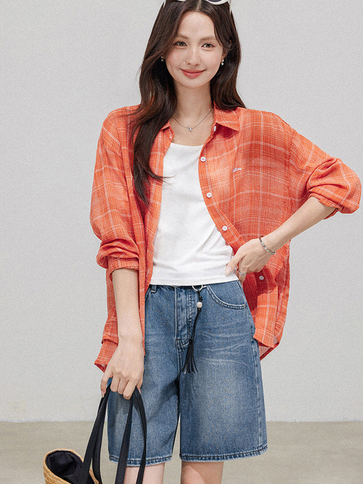 Light blue denim shorts worn with a relaxed fit.
