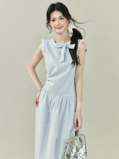 Light blue dress with vertical stripes, lace trim on the shoulders and hem, a bow tie neckline, gathered waist, A-line silhouette, and lace trim.
