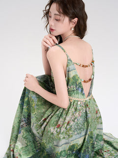 Front view of green floral dress featuring a bow at the waist.