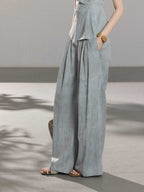 Light blue long pleated skirt with gathered waistband