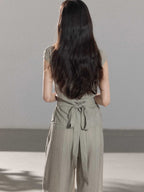 Light grey pants featuring a high-rise design and vertical stripes.