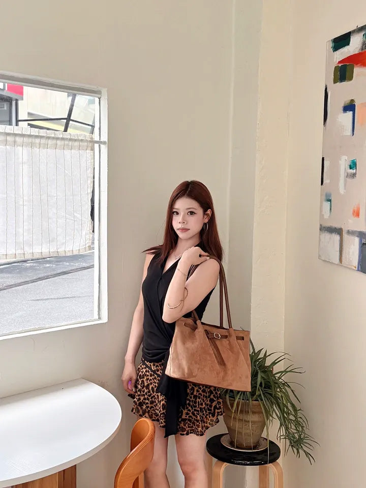 SHEVOV customer look featuring Black Fitted Halter Top with Wrap Front and Asymmetric Hem